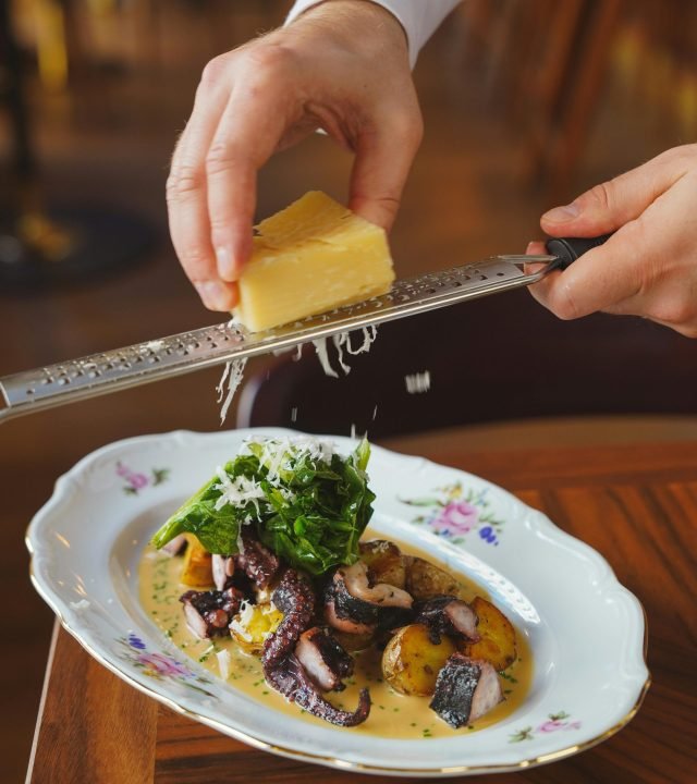 pexels-photo-17402672-17402672 Hands Grating Cheese over Soup